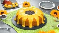Teller mit Sonnenblumenkuchen mit Brigadeiros und Mangocreme